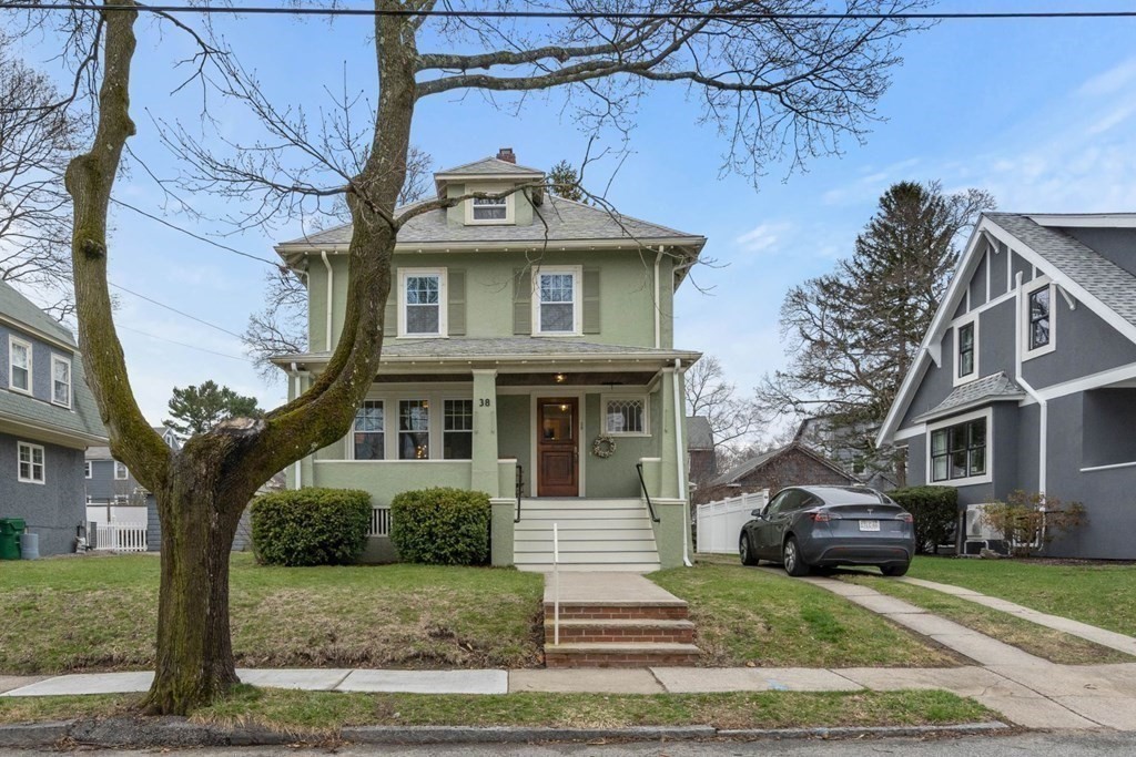 38 Jackson Road Medford, MA 02155 - Photo 6 of 42 a front view of a house with a yard
