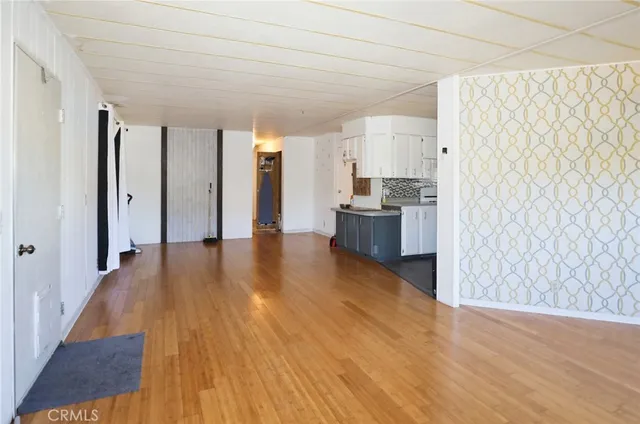 a bedroom with a bed and a potted plant