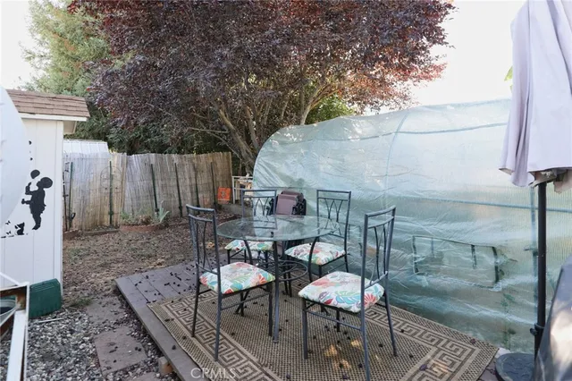 a view of a porch with wooden floor