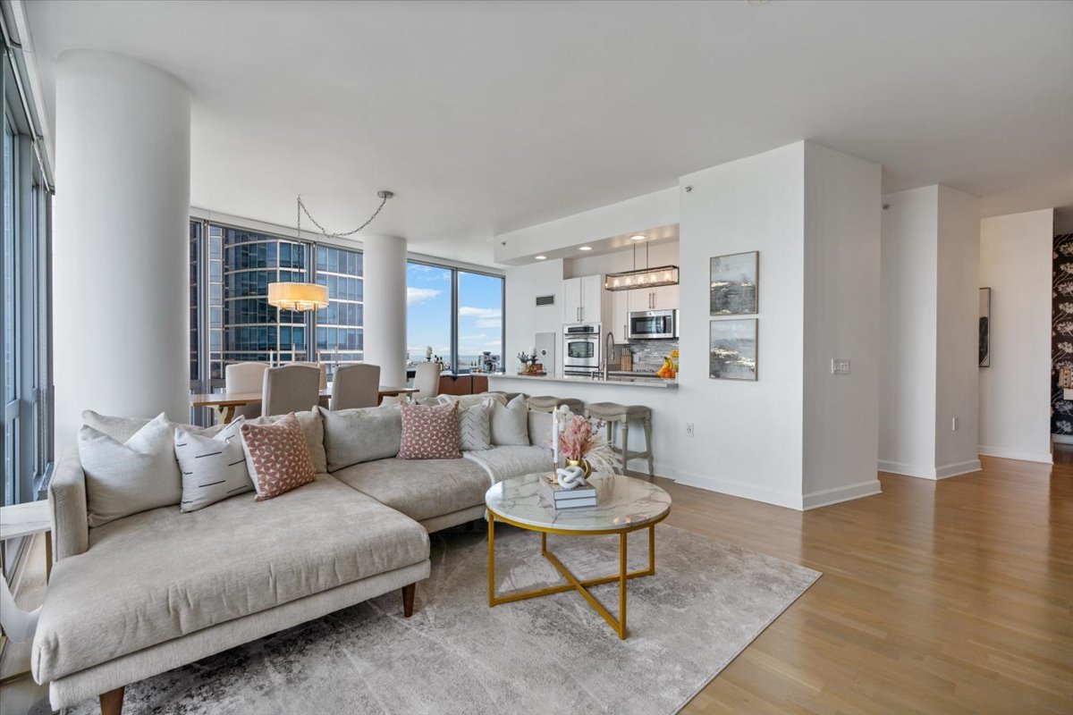 1235 South Prairie Avenue, Unit 2709 Chicago, IL 60605 - Photo 13 of 46 a living room with furniture and view of kitchen