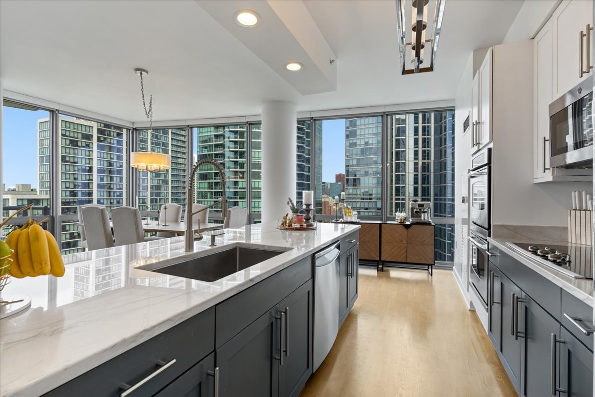 1235 South Prairie Avenue, Unit 2709 Chicago, IL 60605 - Photo 18 of 46 a kitchen with counter top space and windows