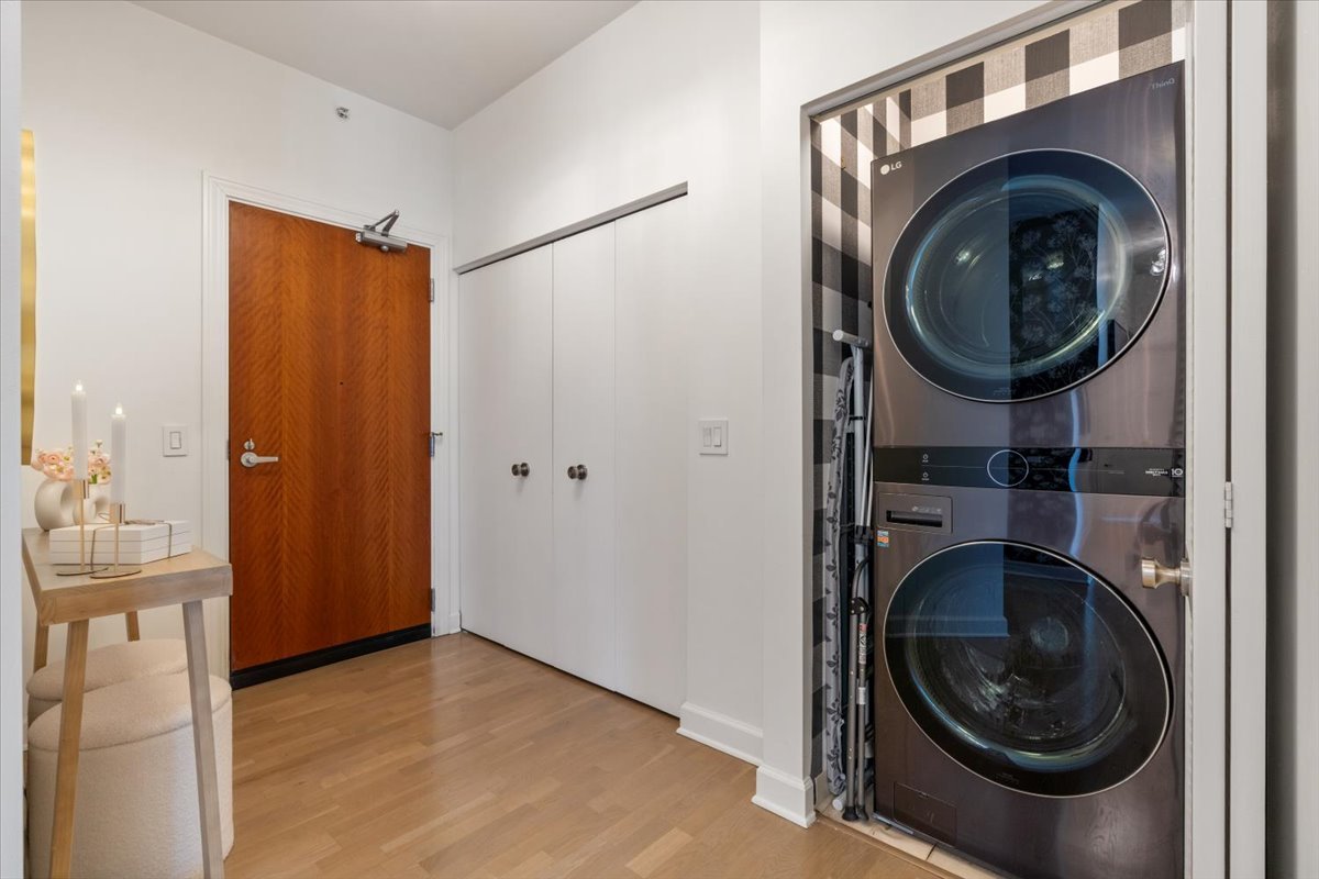 1235 South Prairie Avenue, Unit 2709 Chicago, IL 60605 - Photo 7 of 46 a view of a hallway with washer and dryer
