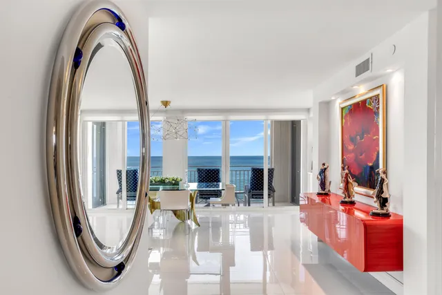 a view of living room with furniture and floor to ceiling window