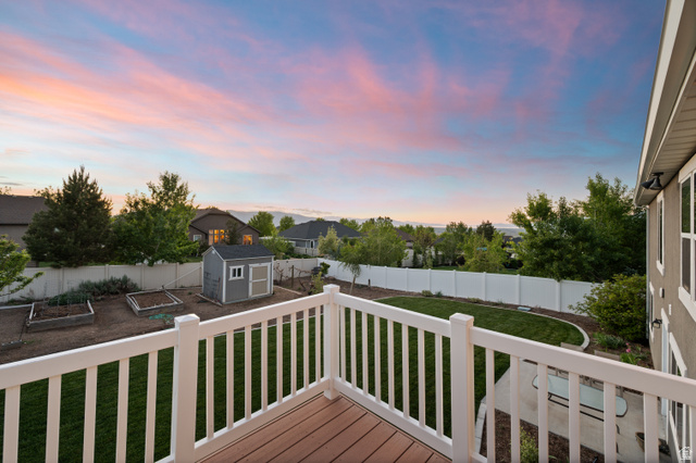 1145 North Christley Lane, Unit 48 Elk Ridge, UT 84651 - Photo 35 of 38 Composite decking with white railing overlooking a fenced backyard