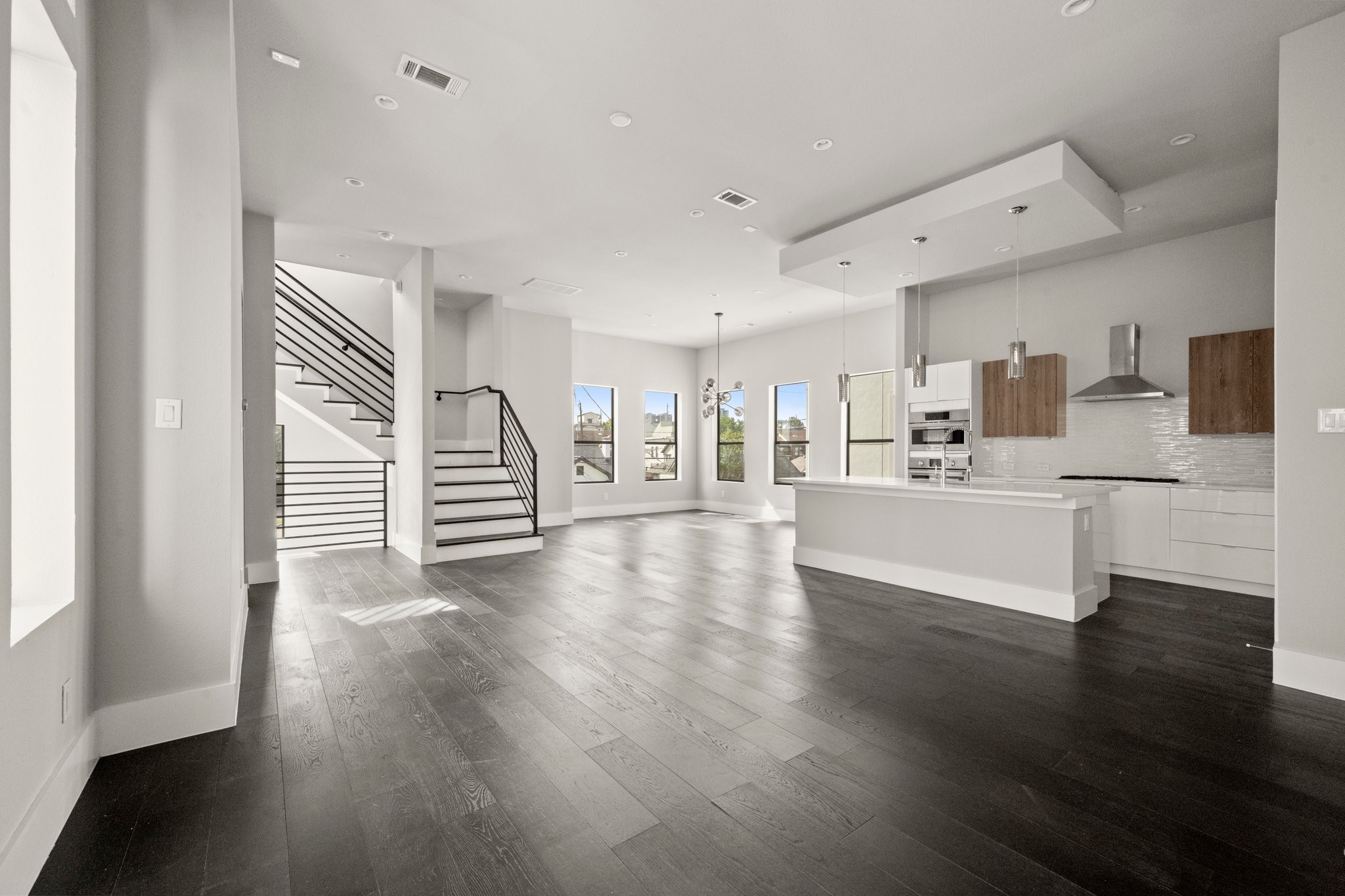 1615 Wheeler Avenue, Unit A Houston, TX 77004 - Photo 12 of 28 a view of a kitchen with a sink cabinets and wooden floor
