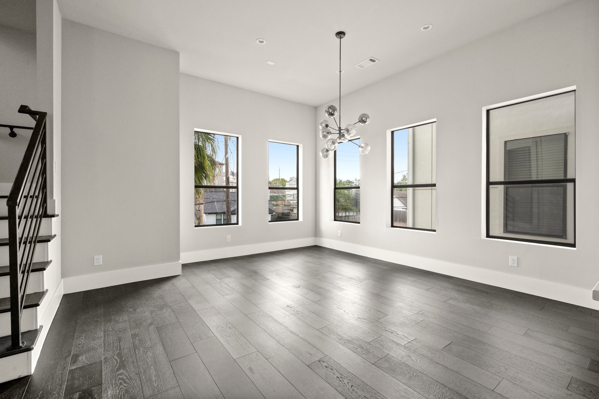1615 Wheeler Avenue, Unit A Houston, TX 77004 - Photo 8 of 28 a view of an empty room with wooden floor fridge and a window