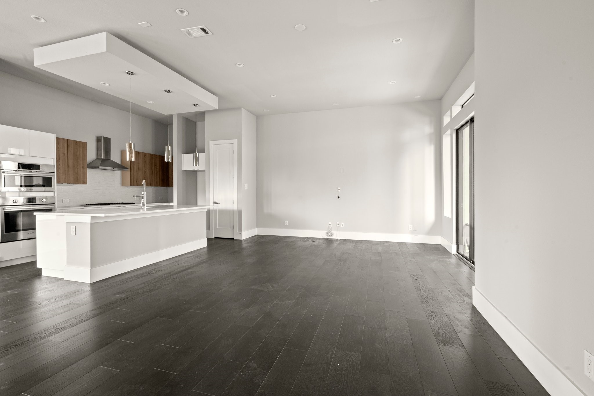 1615 Wheeler Avenue, Unit A Houston, TX 77004 - Photo 10 of 28 a view of a kitchen with wooden floor and electronic appliances