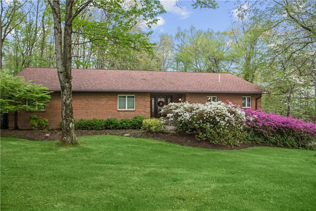 7005 Franklin Road Cranberry Township, PA 16066 - Photo 1 of 26 a view of a house with a garden