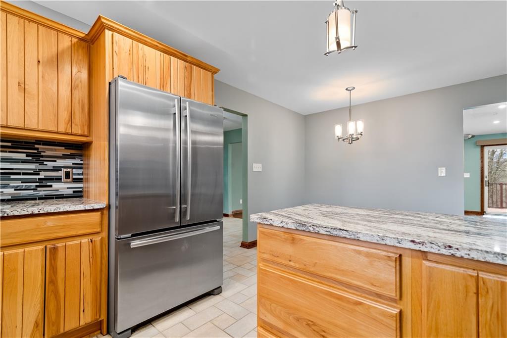 7005 Franklin Road Cranberry Township, PA 16066 - Photo 11 of 26 a kitchen with stainless steel appliances granite countertop a refrigerator and a sink