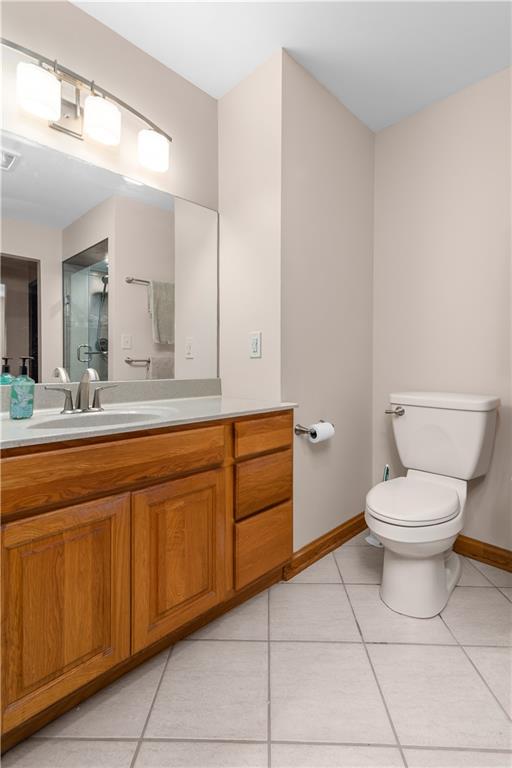 7005 Franklin Road Cranberry Township, PA 16066 - Photo 17 of 26 a spacious bathroom with a toilet a sink and mirror