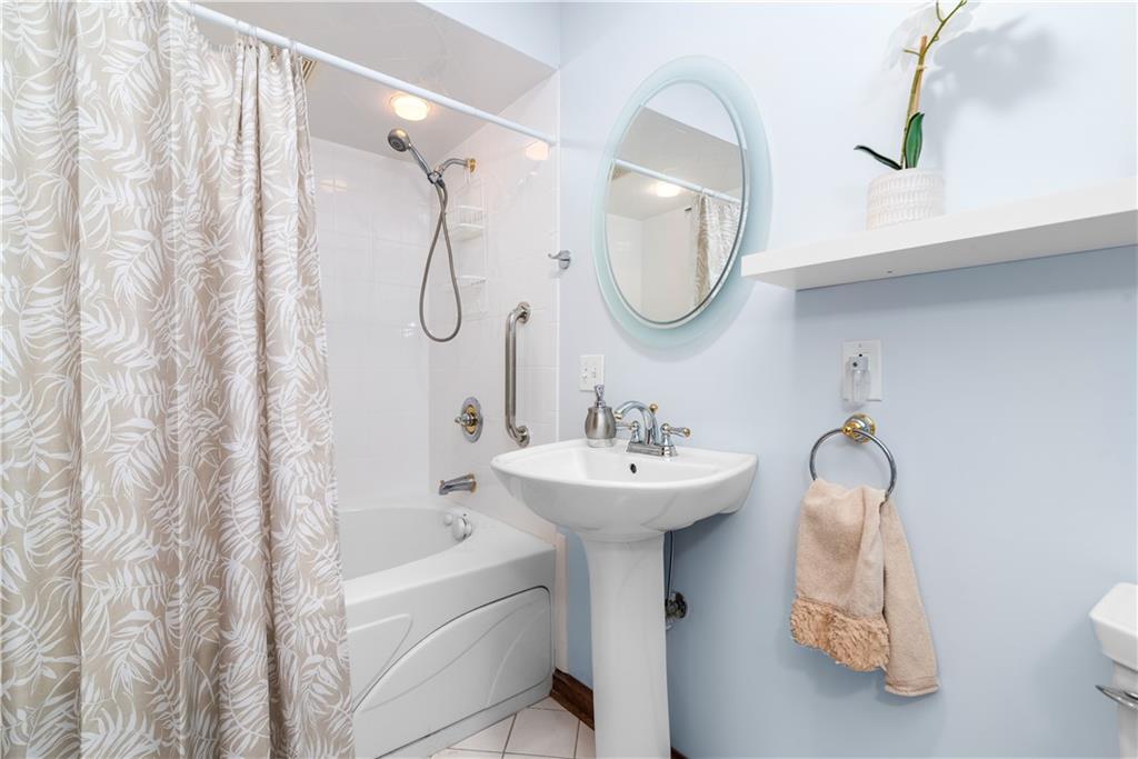 7005 Franklin Road Cranberry Township, PA 16066 - Photo 19 of 26 a bathroom with a sink a toilet and a mirror