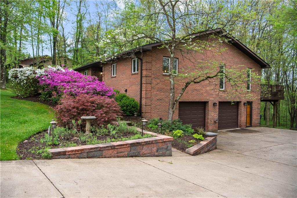 7005 Franklin Road Cranberry Township, PA 16066 - Photo 2 of 26 a front view of a house with yard