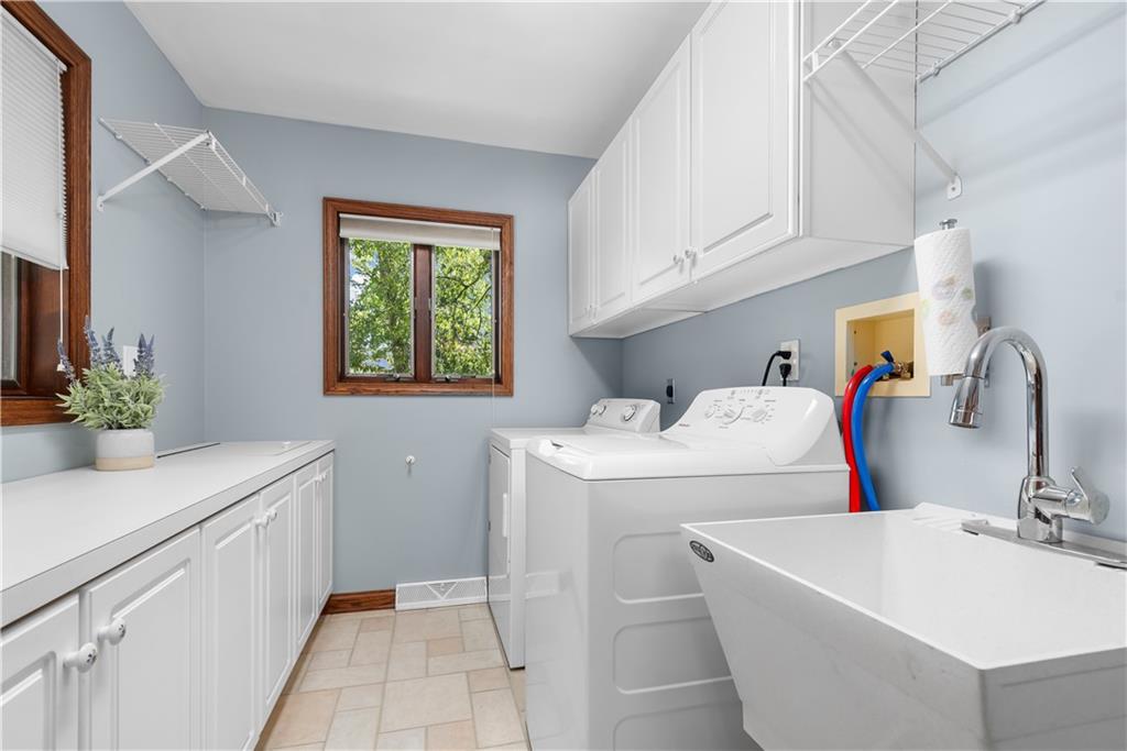 7005 Franklin Road Cranberry Township, PA 16066 - Photo 22 of 26 a bathroom with a sink and mirror with bathtub