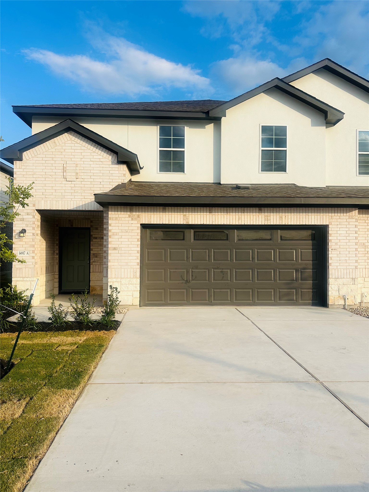 a front view of a house with yard