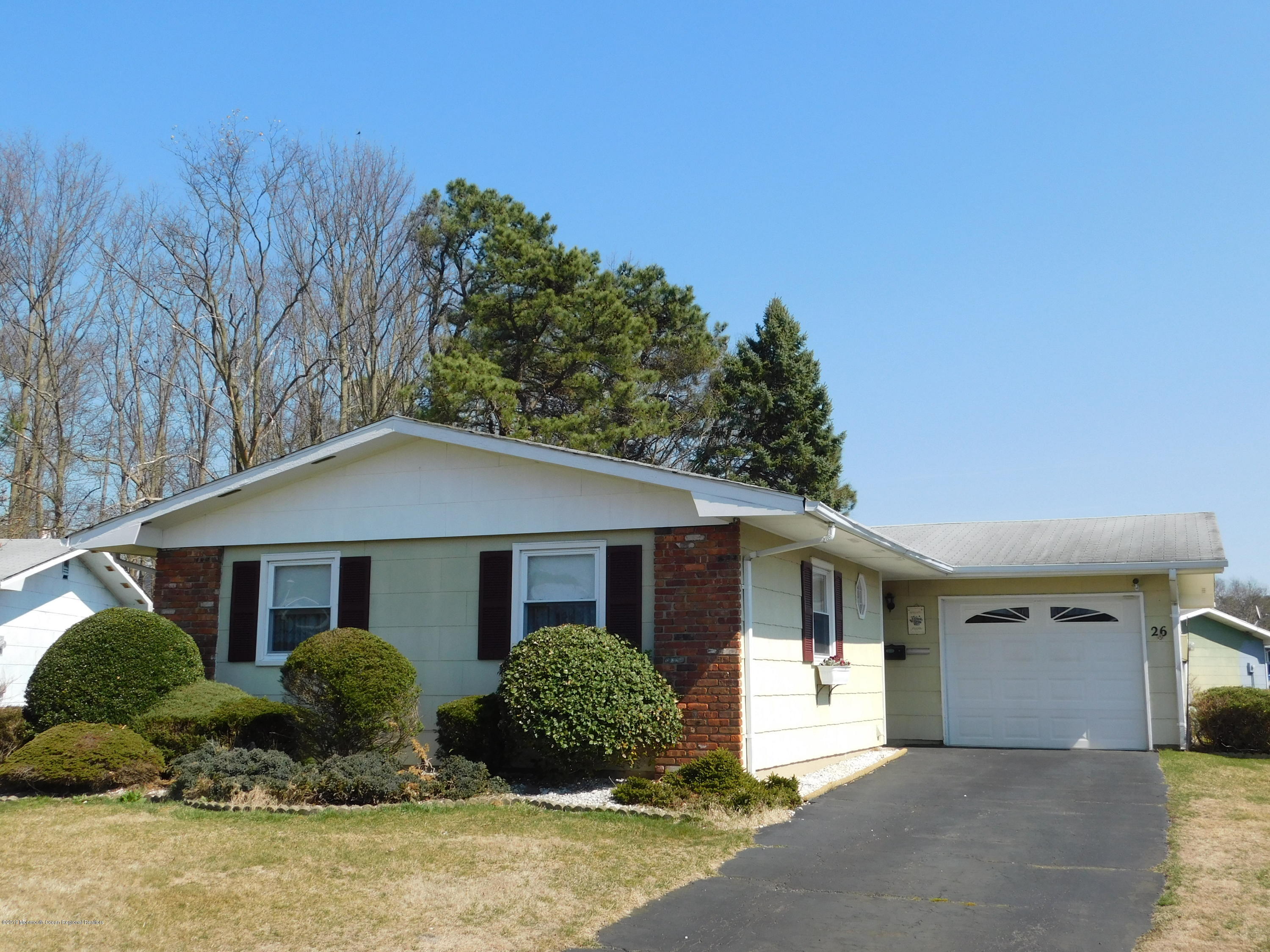 26 Masters Road Brick, NJ 08724 - Photo 1 of 14 a front view of a house with a yard
