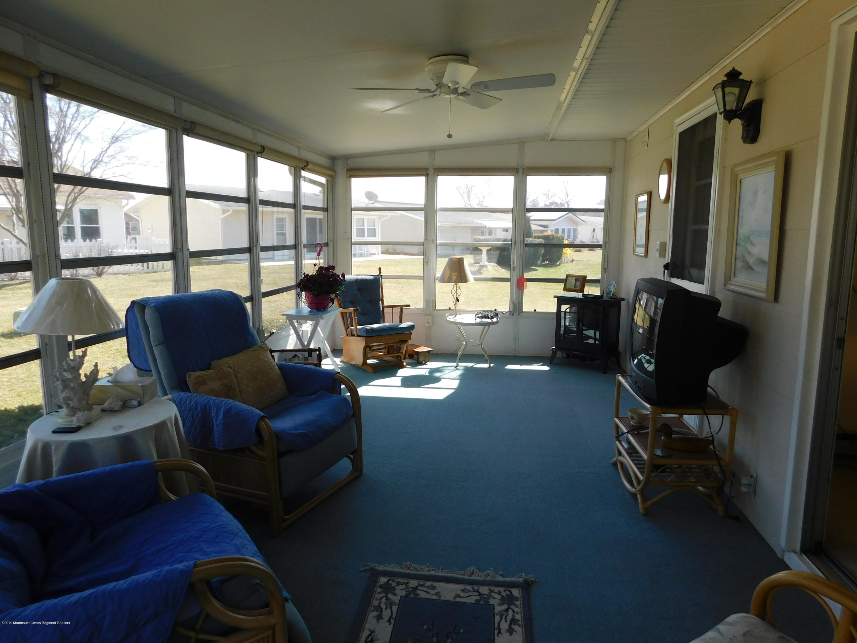 26 Masters Road Brick, NJ 08724 - Photo 11 of 14 a living room with furniture and a floor to ceiling window