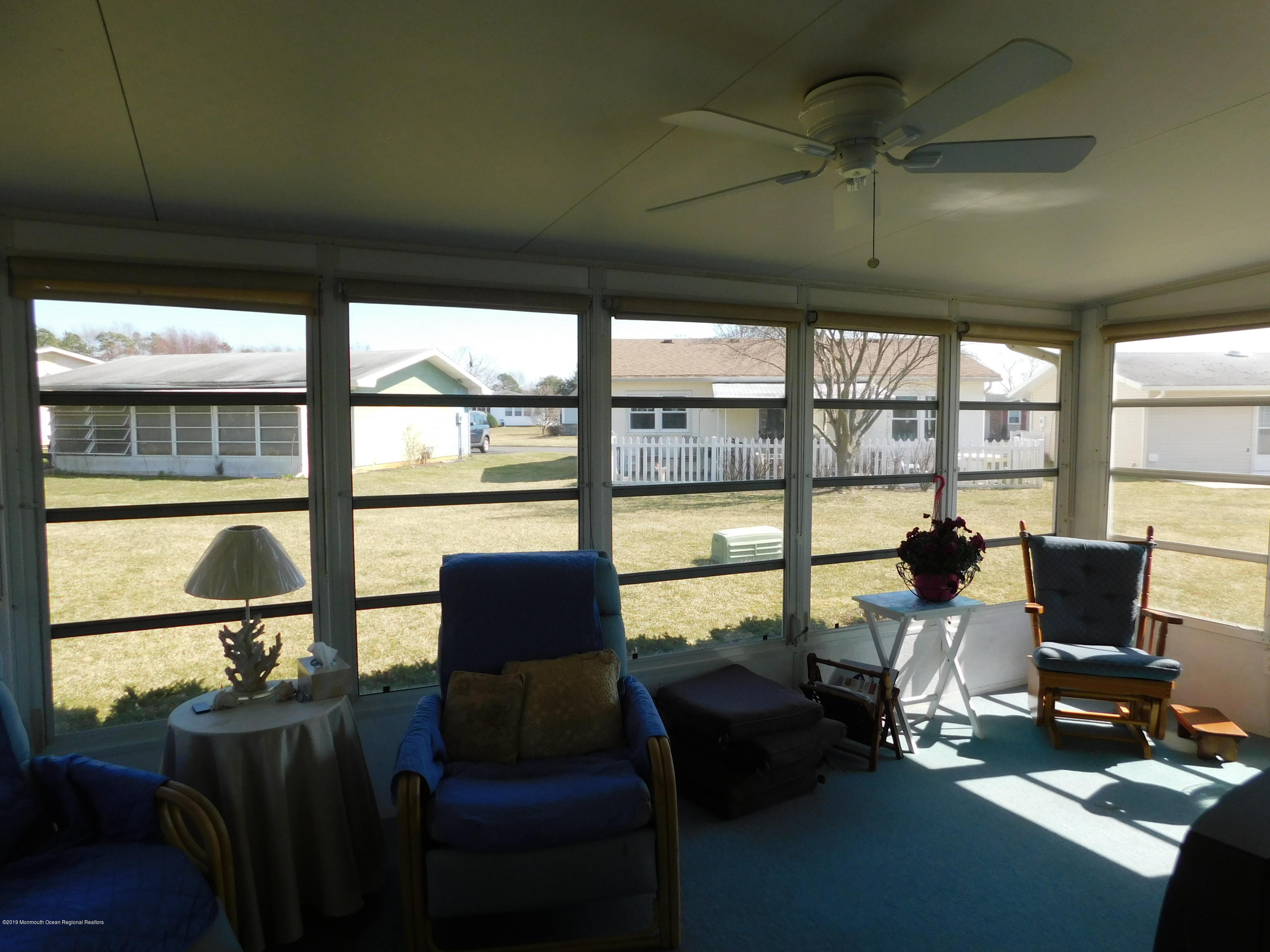 26 Masters Road Brick, NJ 08724 - Photo 12 of 14 a living room with furniture and a floor to ceiling window