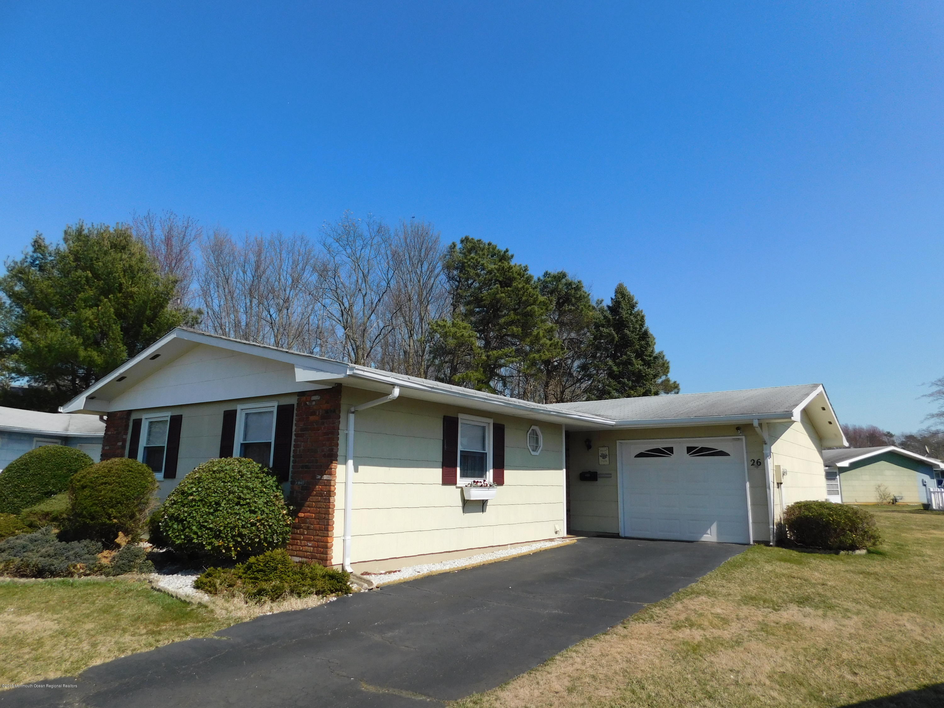 26 Masters Road Brick, NJ 08724 - Photo 2 of 14 a front view of a house with a yard