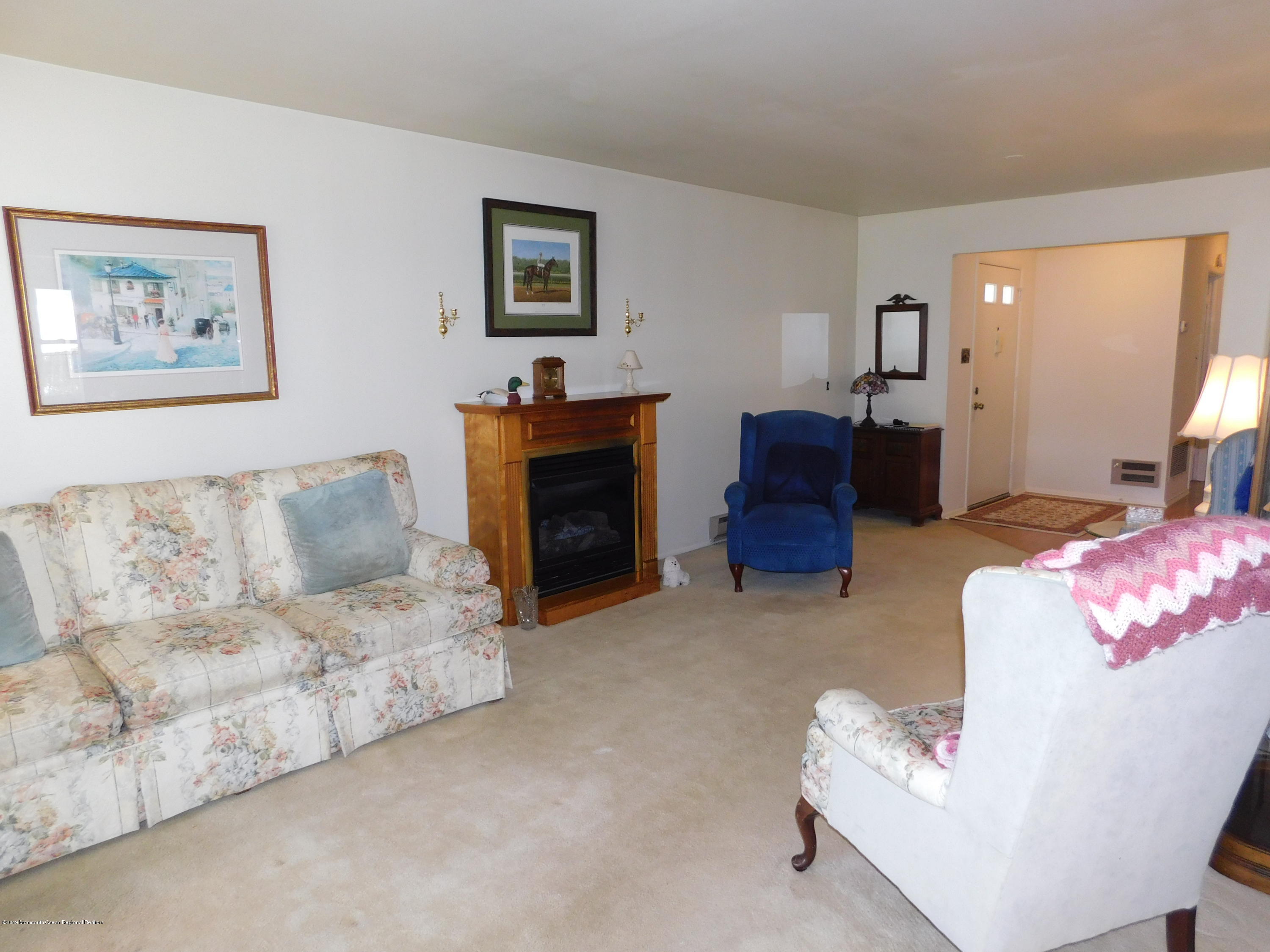 26 Masters Road Brick, NJ 08724 - Photo 3 of 14 a living room with furniture and a flat screen tv