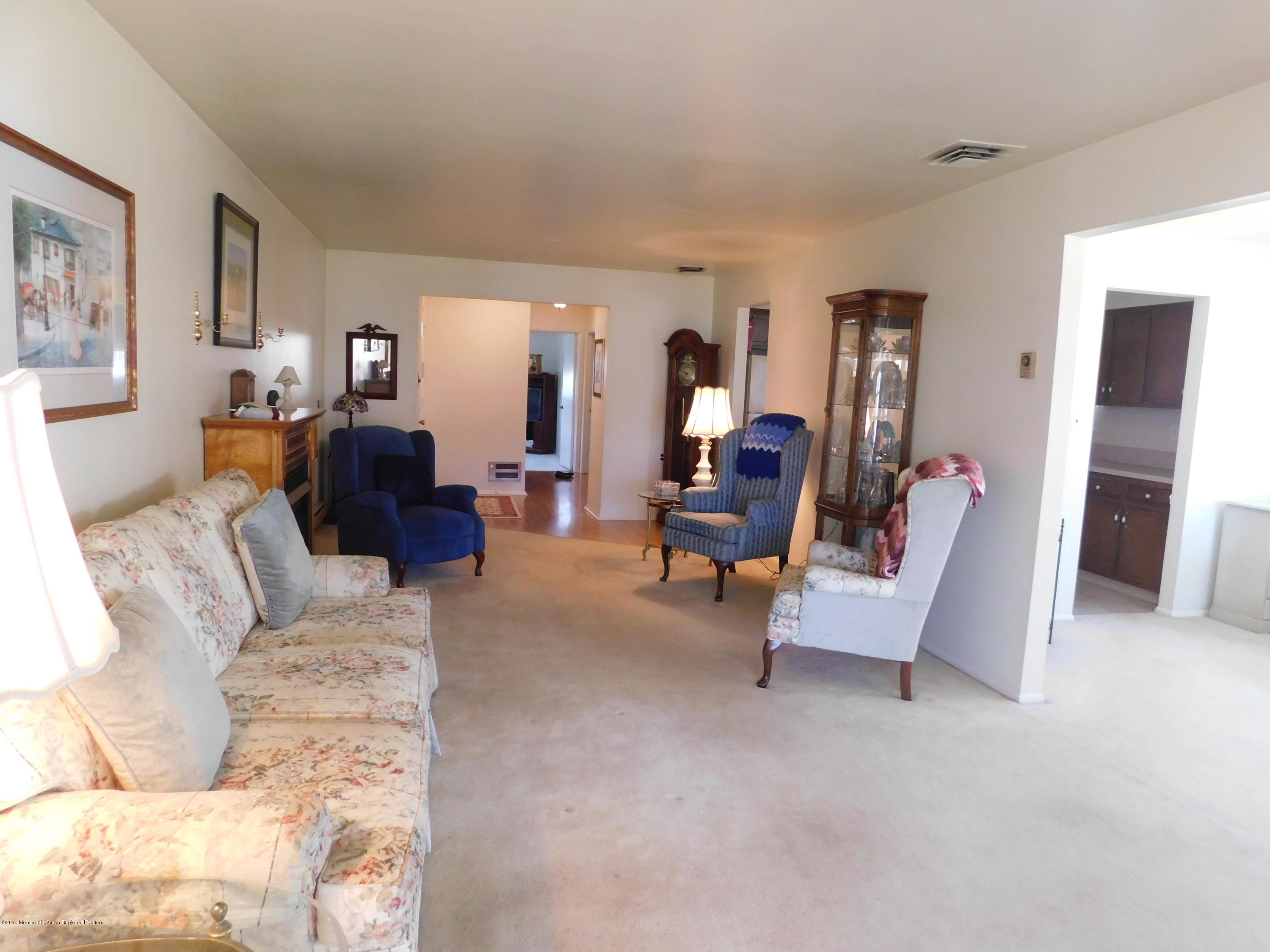 26 Masters Road Brick, NJ 08724 - Photo 4 of 14 a living room with furniture and a flat screen tv