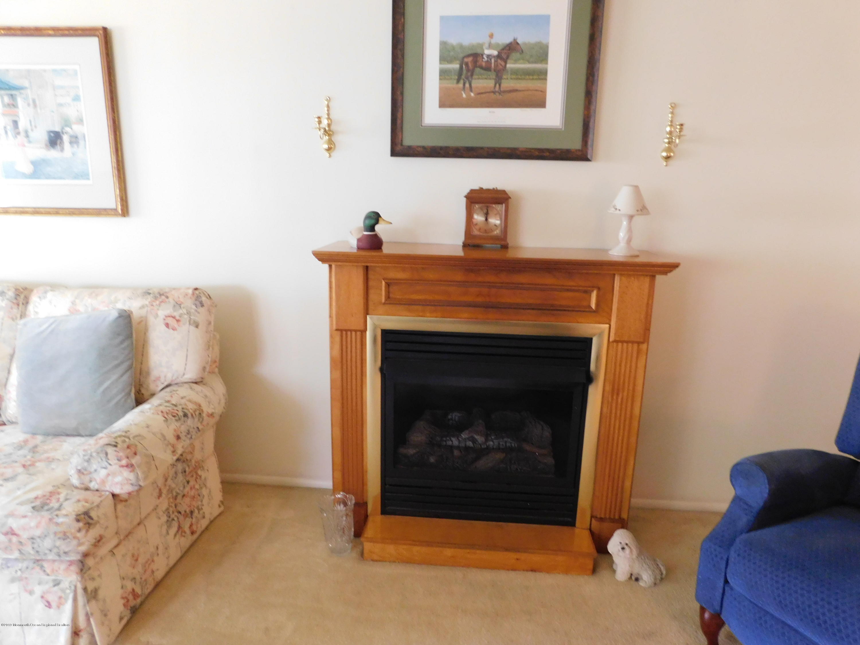 26 Masters Road Brick, NJ 08724 - Photo 5 of 14 a living room with furniture and a fireplace