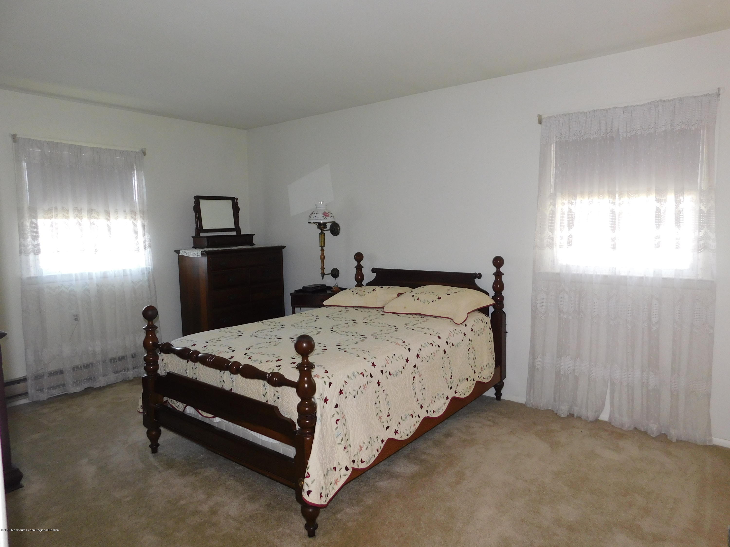 26 Masters Road Brick, NJ 08724 - Photo 9 of 14 a bedroom with a bed and a window