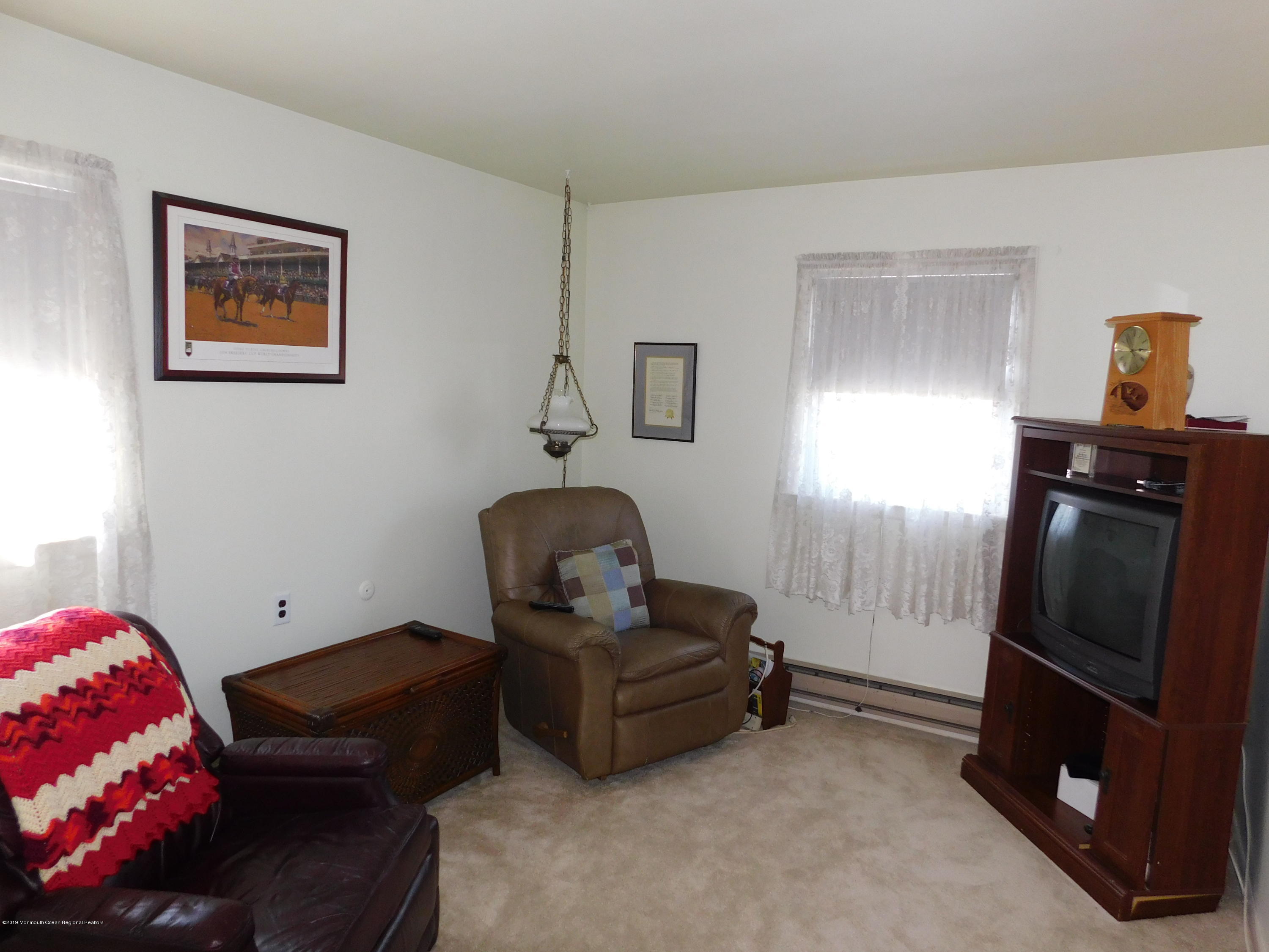 26 Masters Road Brick, NJ 08724 - Photo 10 of 14 a living room with furniture and a window