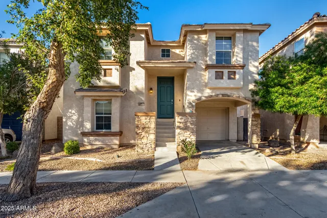 a front view of a house with yard