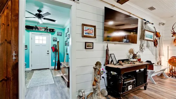 a living room with furniture and a flat screen tv