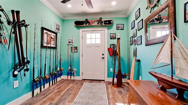 a view of an entryway with wooden floor and stairs