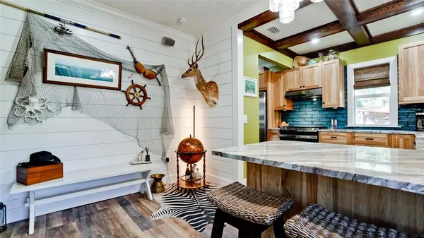 a dining room with furniture and a chandelier