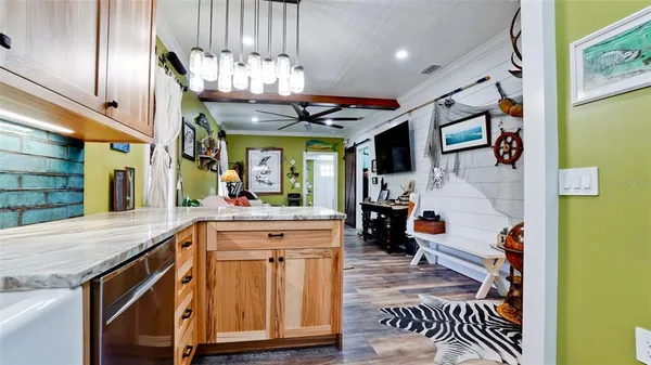 a kitchen with stainless steel appliances granite countertop a sink and cabinets
