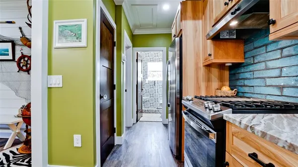 a kitchen with a stove and a refrigerator