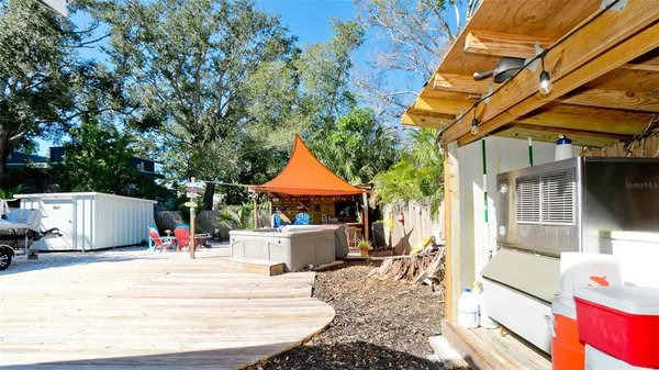 a view of a park with bench and trees