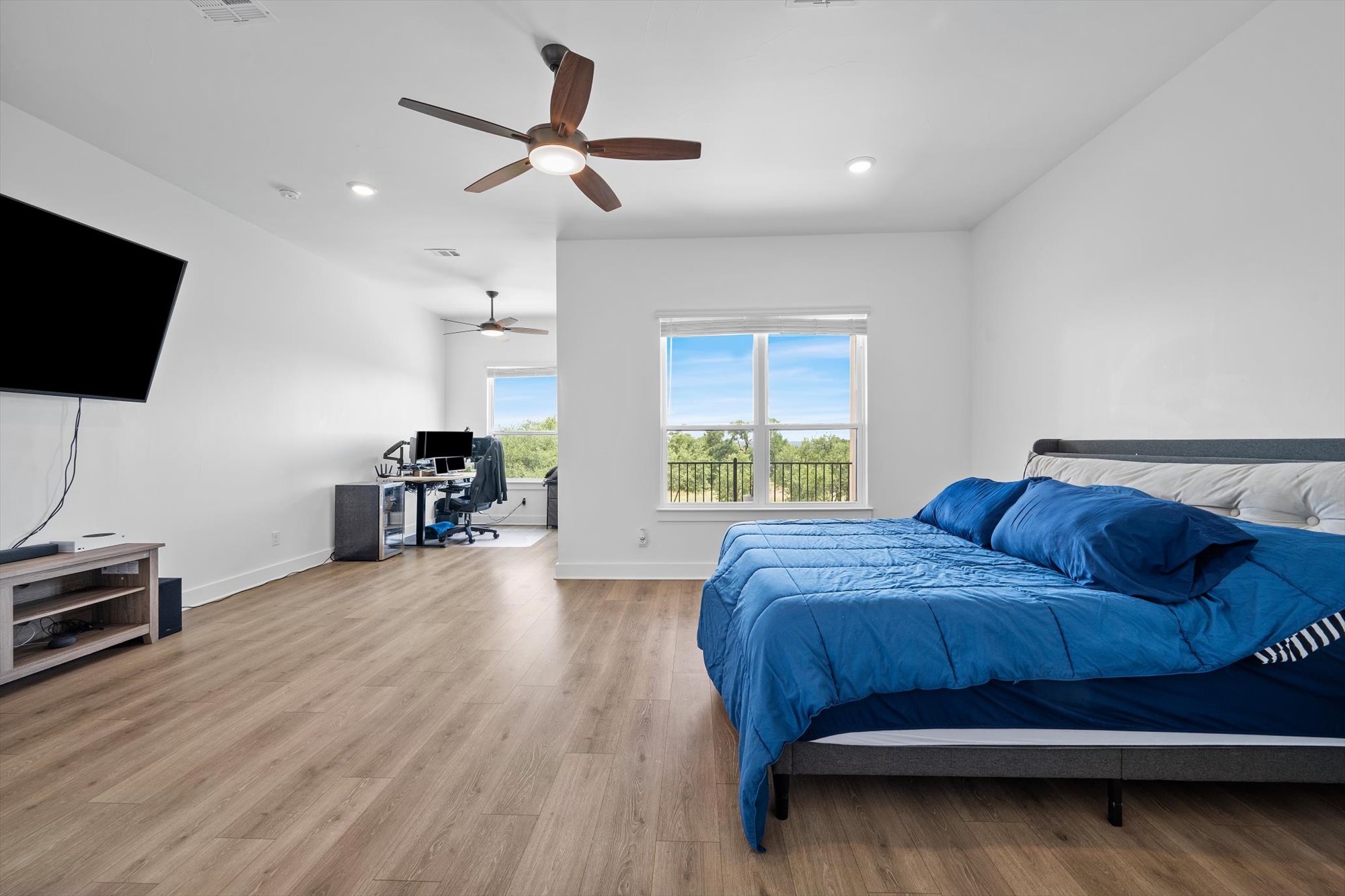 638 Strada Luca Florence, TX 76527 - Photo 18 of 38 Hardwood floors and lofty ceilings create an inviting and serene bedroom space.
