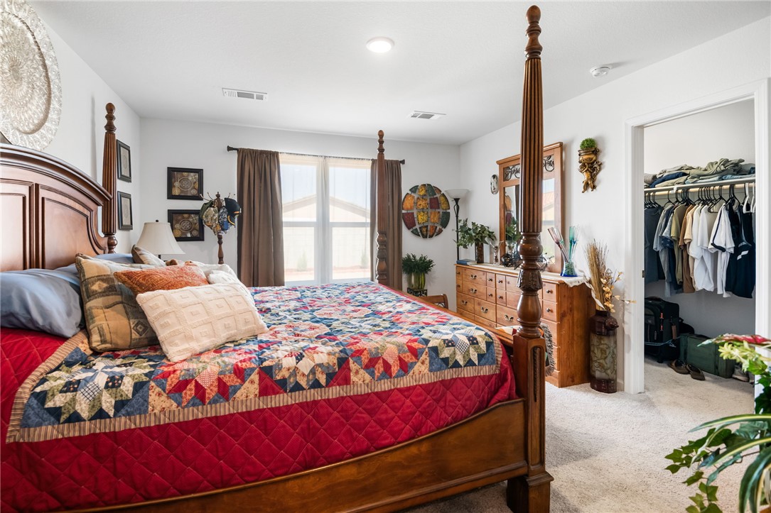 3623 East Andrea Drive Kingman, AZ 86409 - Photo 23 of 40 This bedroom features carpeted flooring, white walls, and a window with blinds and curtains