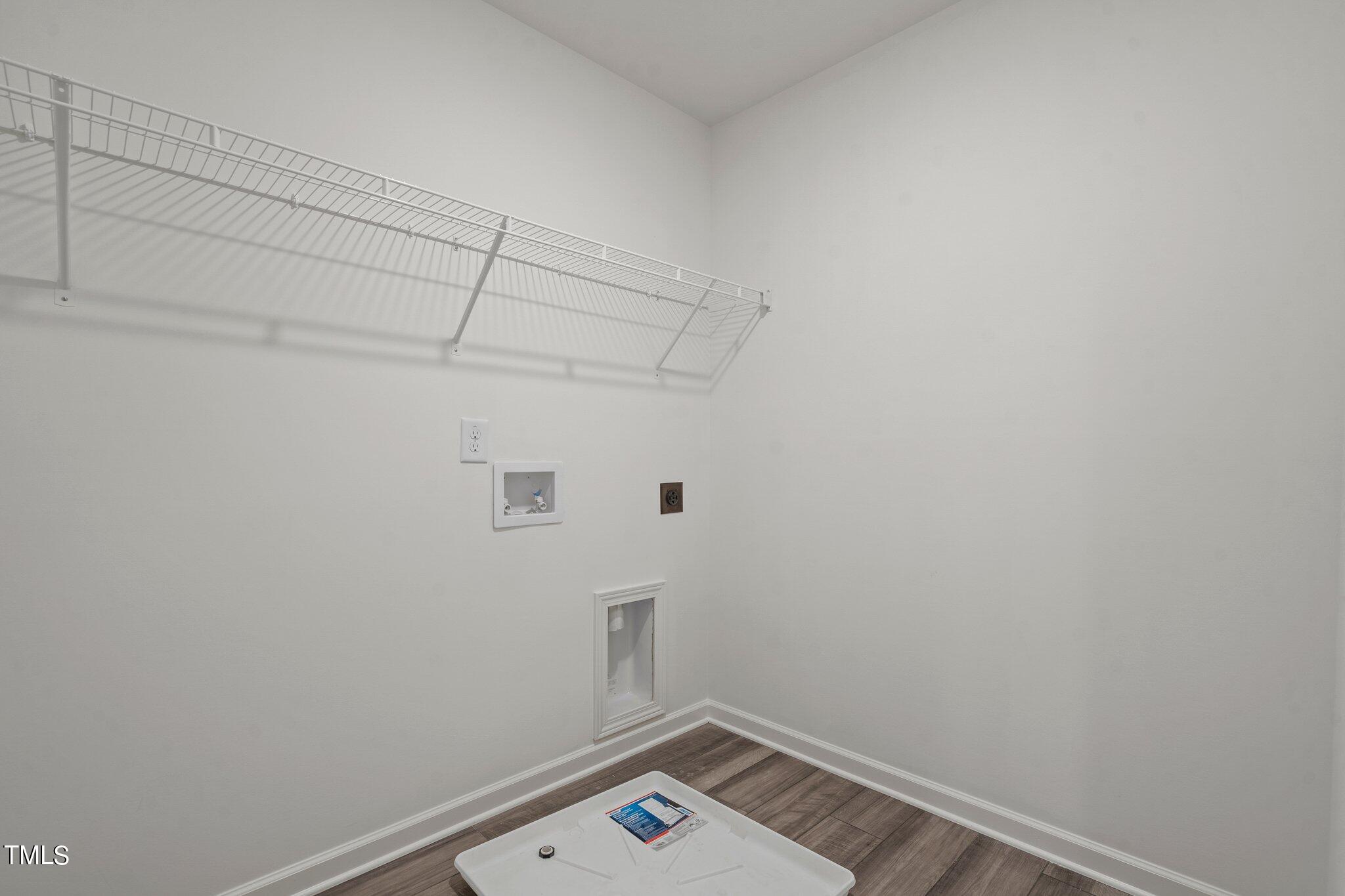 800 Piaggio Lane Spring Hope, NC 27882 - Photo 13 of 33 a view of a small space with racks on the wall