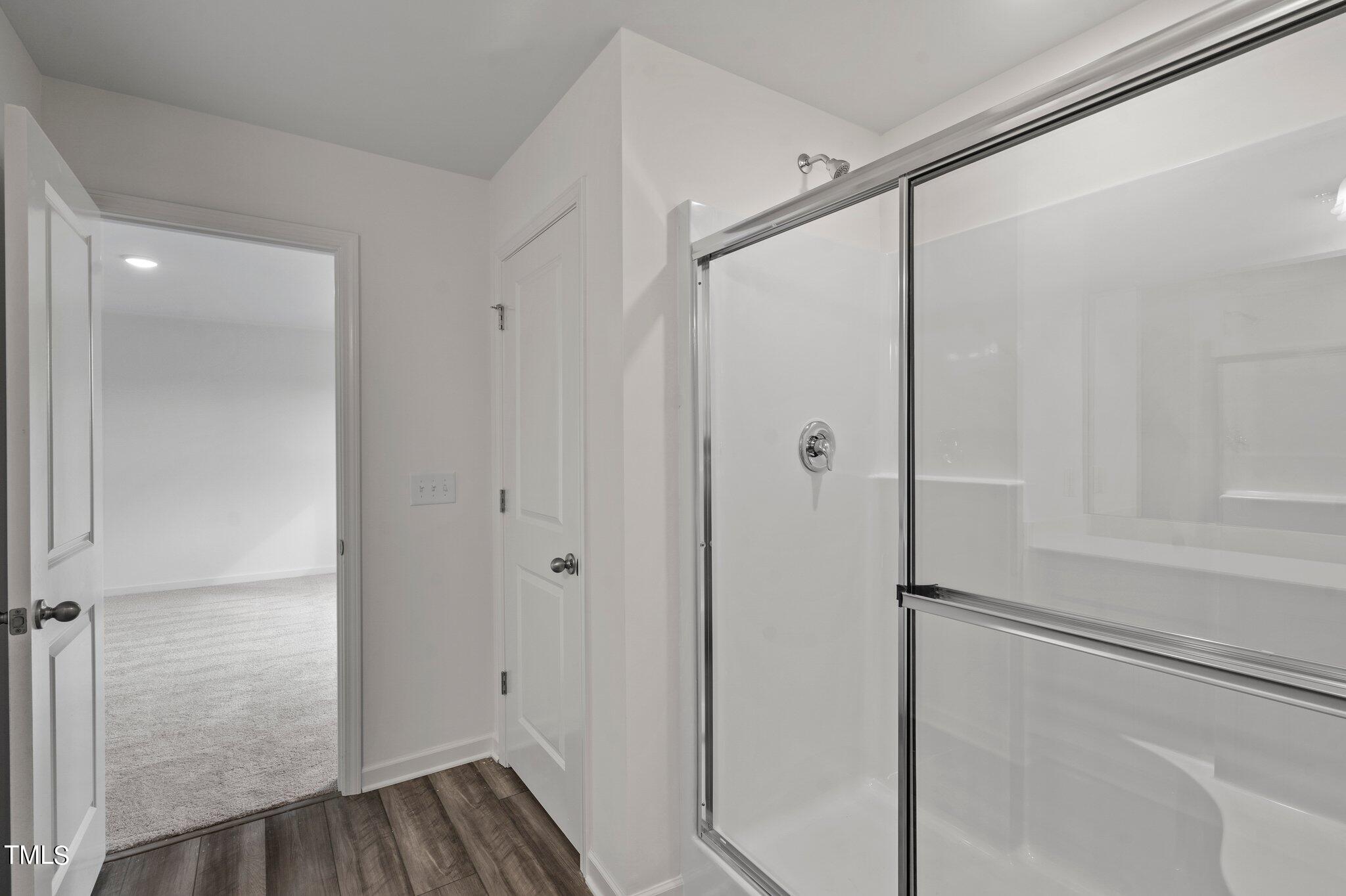 800 Piaggio Lane Spring Hope, NC 27882 - Photo 15 of 33 a bathroom with a glass shower door