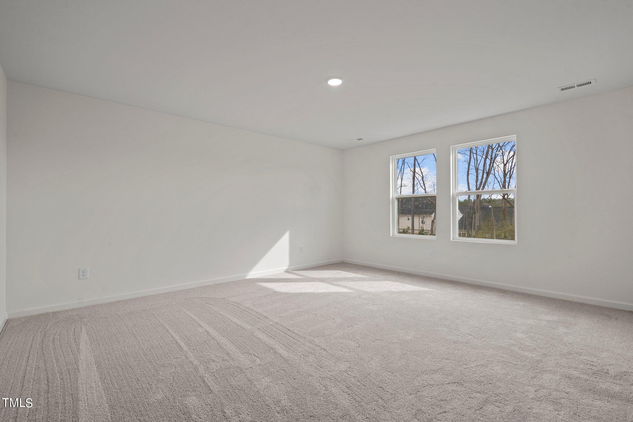 800 Piaggio Lane Spring Hope, NC 27882 - Photo 19 of 33 a view of an empty room with a window