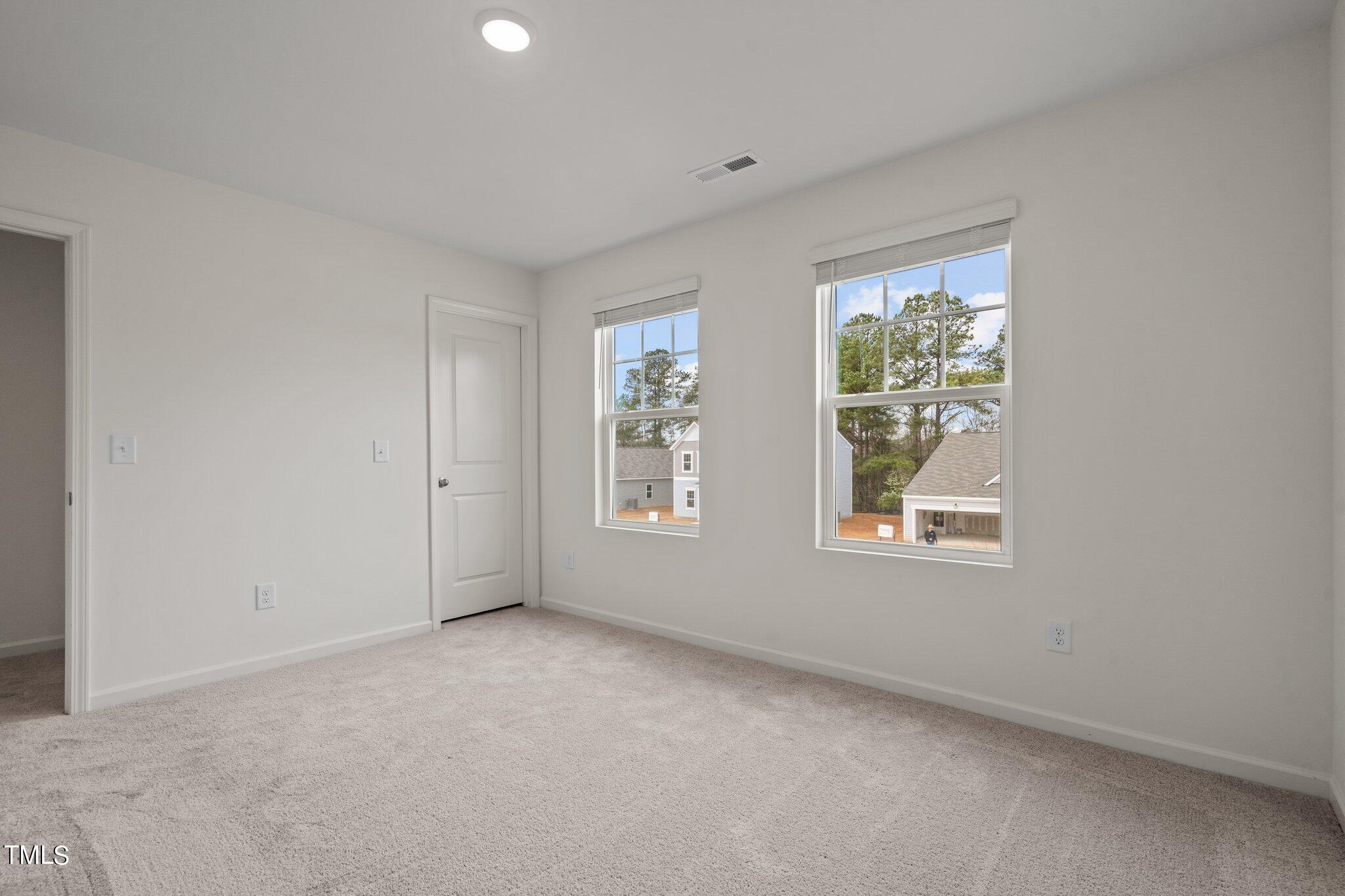 800 Piaggio Lane Spring Hope, NC 27882 - Photo 20 of 33 an empty room with windows