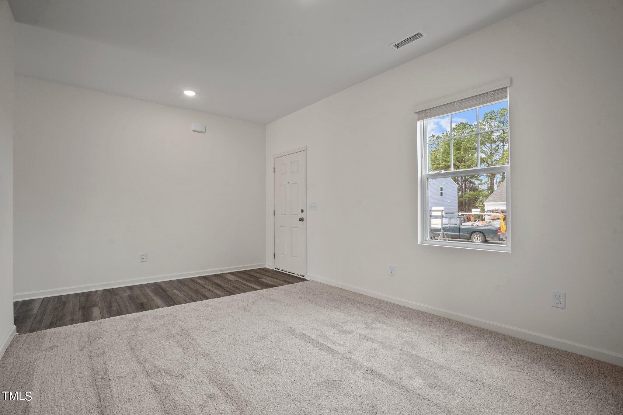 800 Piaggio Lane Spring Hope, NC 27882 - Photo 32 of 33 a view of an empty room with a window