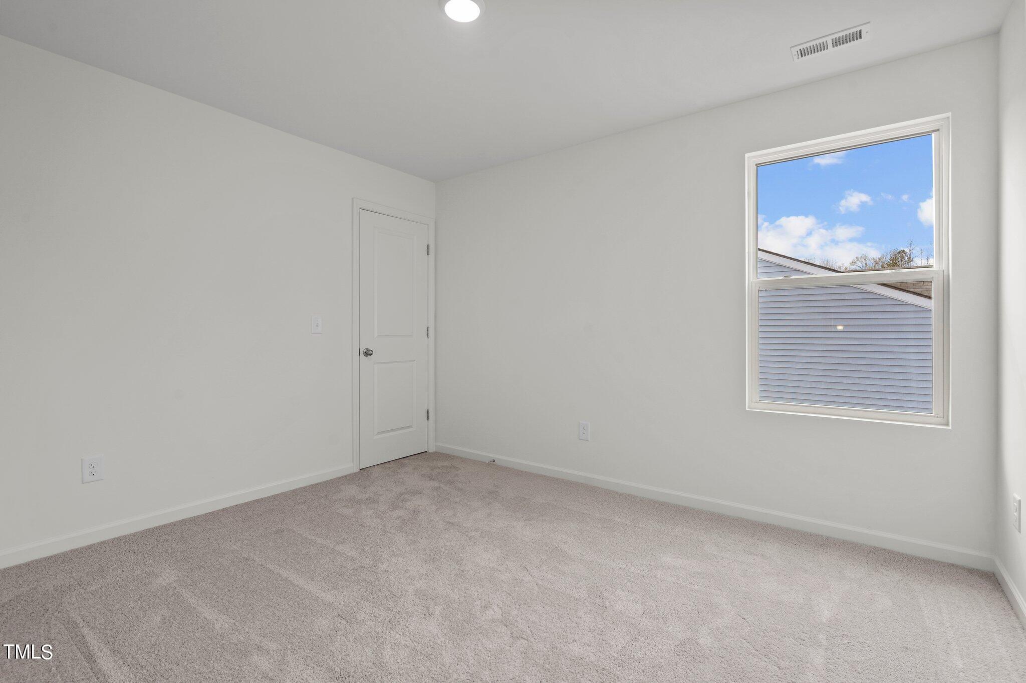 800 Piaggio Lane Spring Hope, NC 27882 - Photo 9 of 33 an empty room with windows