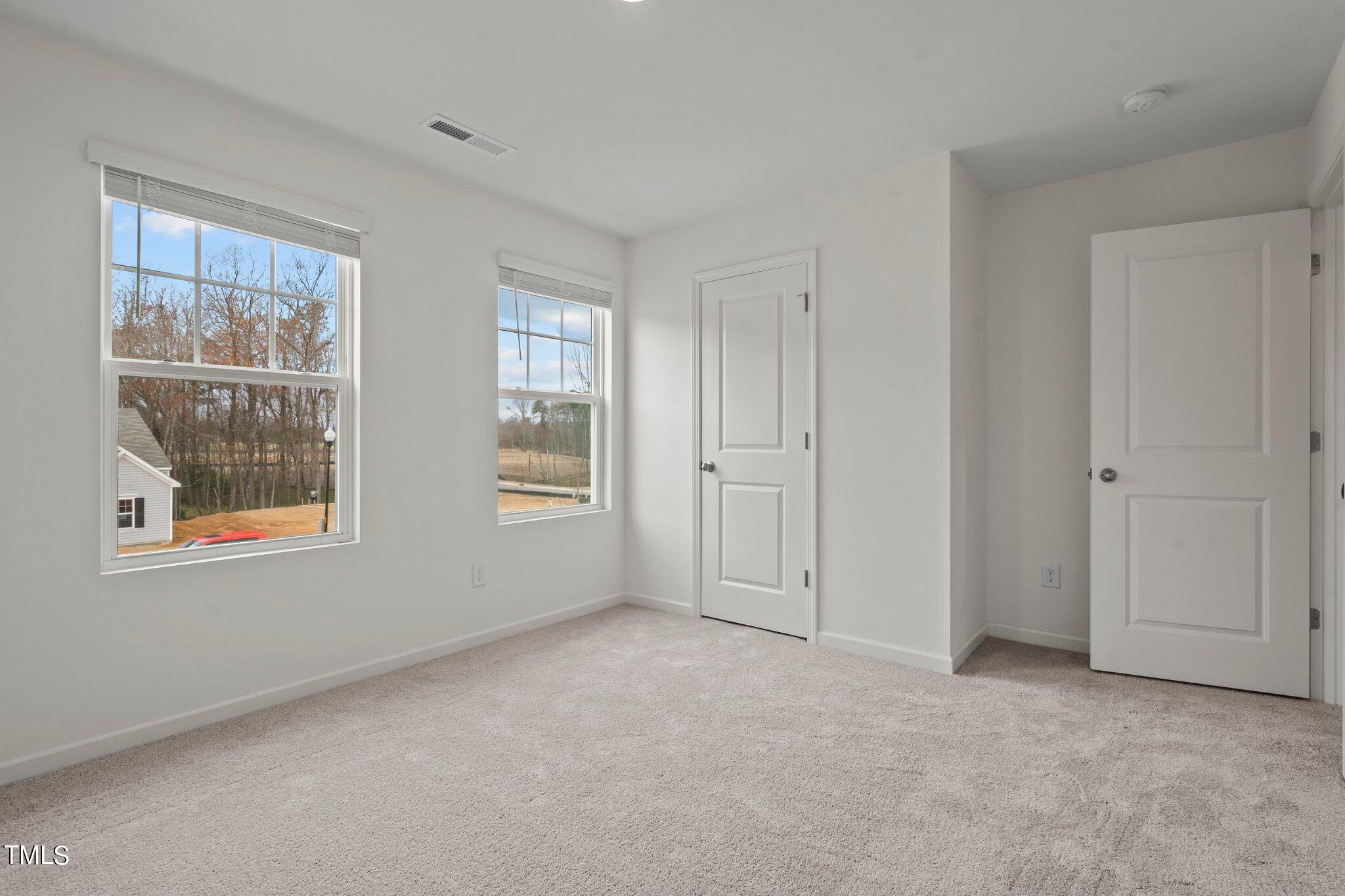 800 Piaggio Lane Spring Hope, NC 27882 - Photo 10 of 33 a view of an empty room with a window