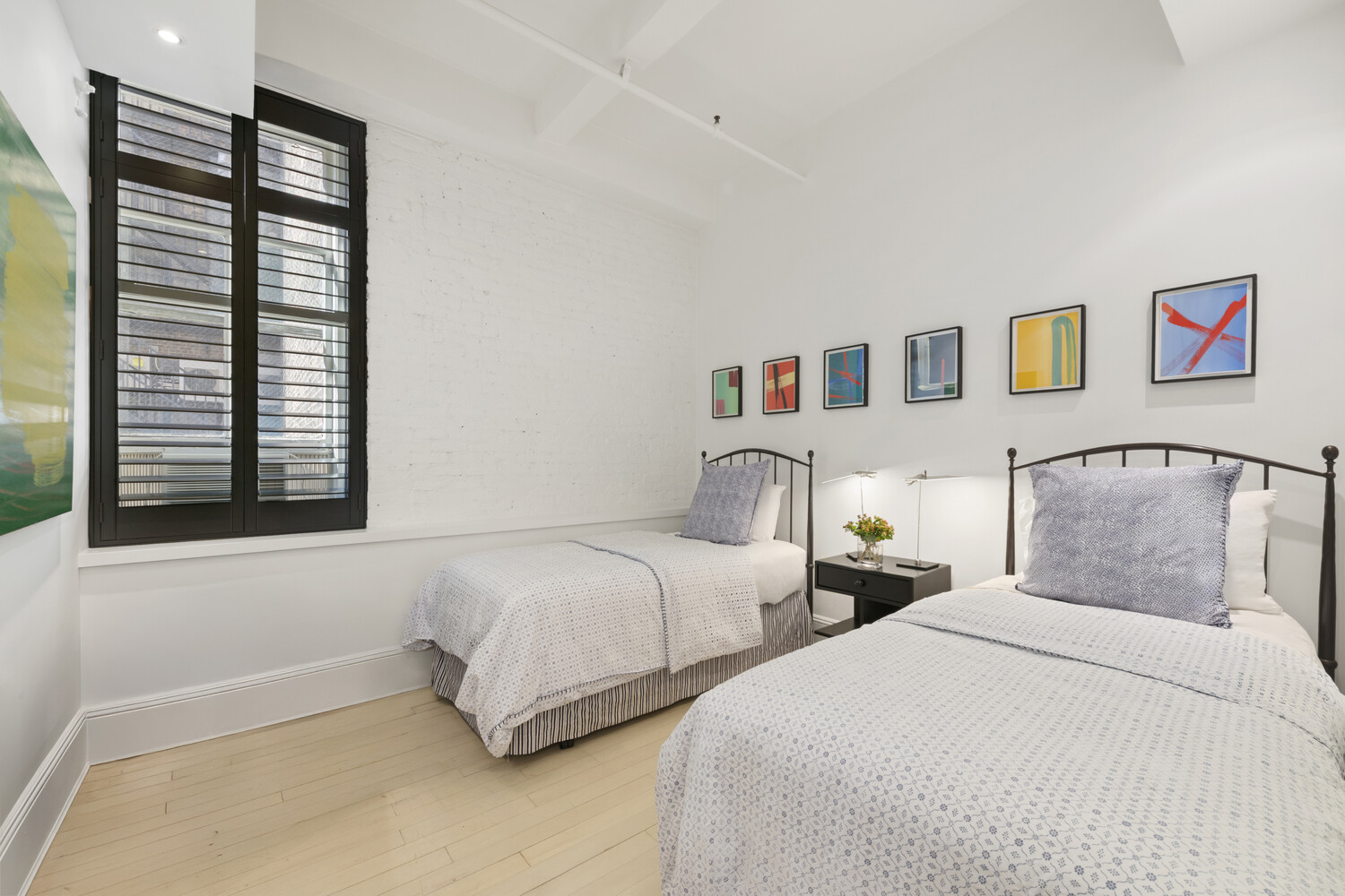 7 East 20th Street, Unit 6R Manhattan, NY 10003 - Photo 9 of 15 a bedroom with two beds and a window