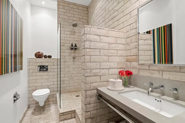 a bedroom with two beds and a window