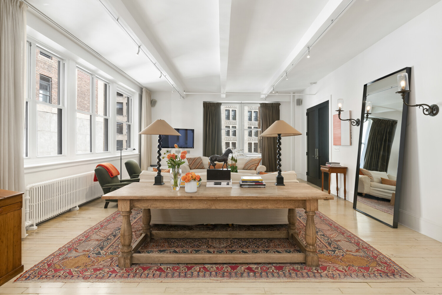 7 East 20th Street, Unit 6R Manhattan, NY 10003 - Photo 3 of 15 a living room with furniture and a rug