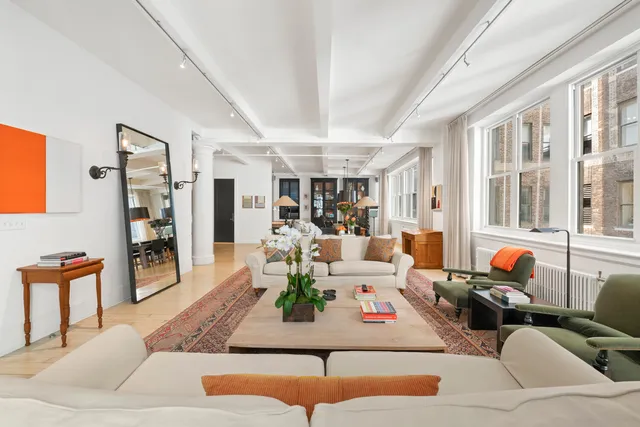a living room with furniture and a rug