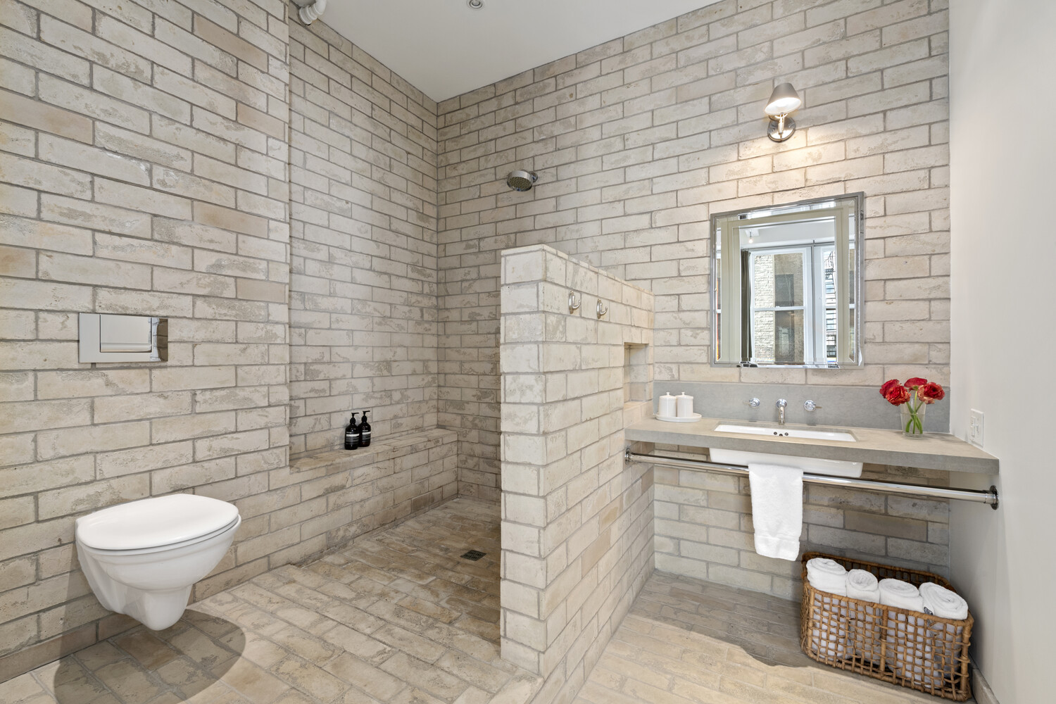 7 East 20th Street, Unit 6R Manhattan, NY 10003 - Photo 8 of 15 a bathroom with a toilet a sink and mirror