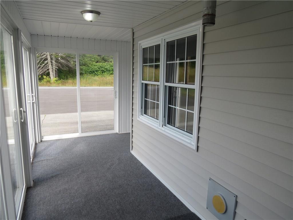 2014 Aroostook Road Wallagrass, ME 04781 - Photo 7 of 27 Enclosed Porch Around Southern and...