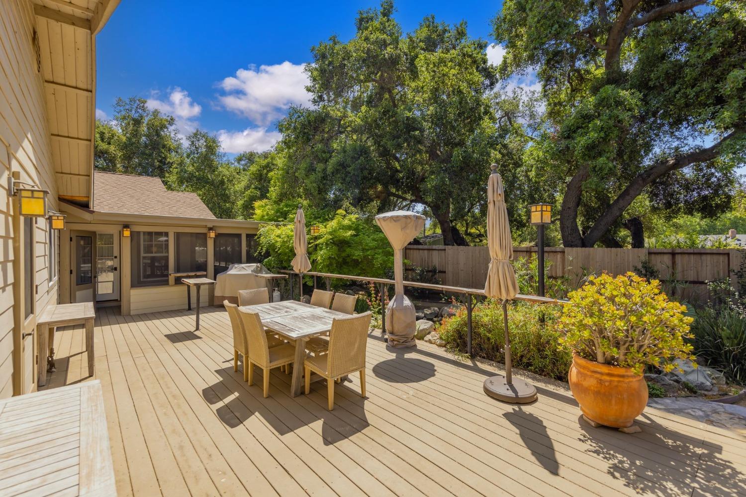 868 Fairview Road Ojai, CA 93023 - Photo 12 of 15 a view of a patio with couches table and chairs and potted plants
